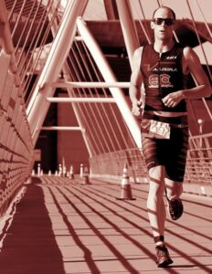 Arizona trademark attorney Tom Galvani running in a triathlon in Tempe