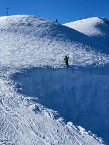 photograph of skier Tom Galvani above Daly Chute 10 at Deer Valley